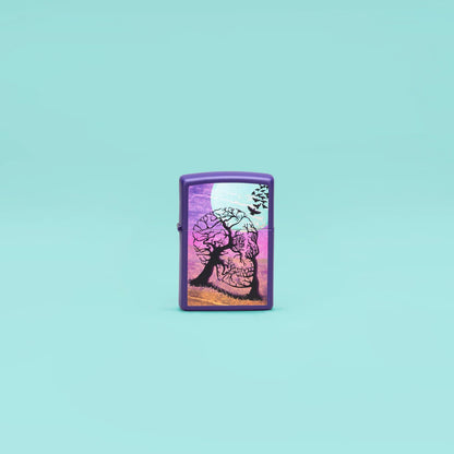 Lifestyle image of Zippo Skull Tree Design Purple Matte Windproof Lighter standing in a blue scene.