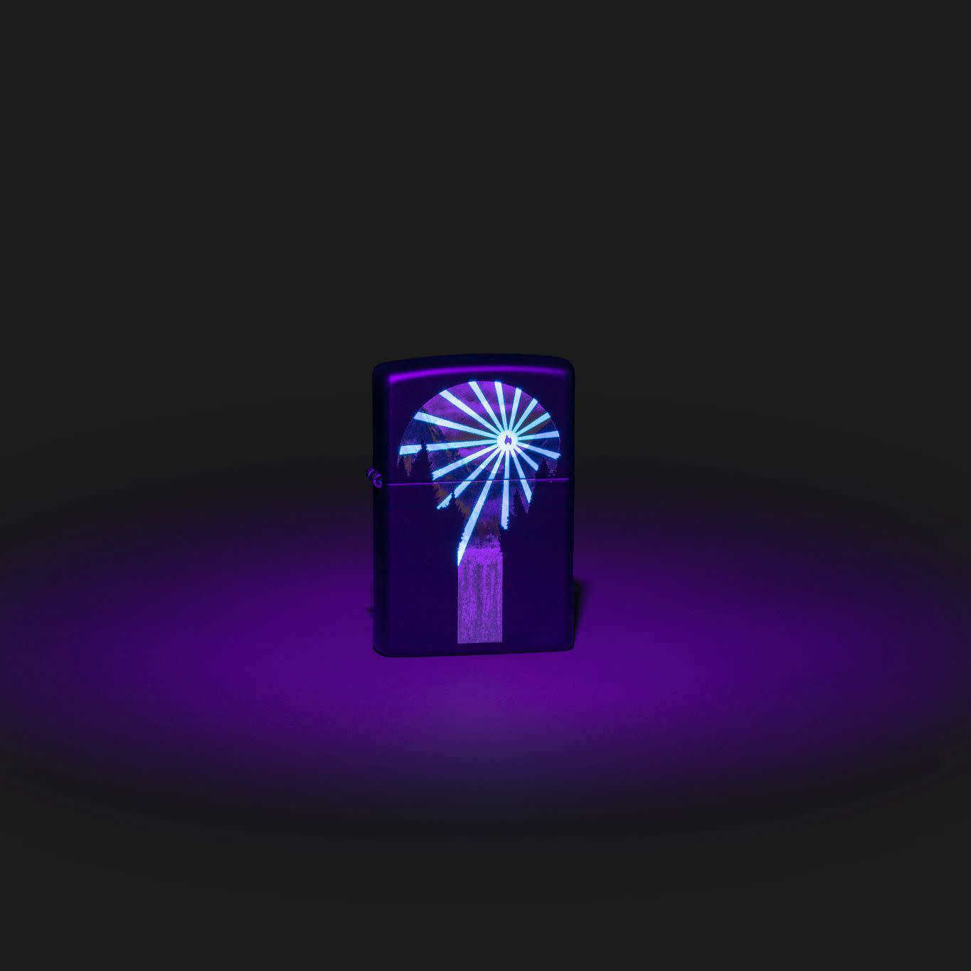 Lifestyle image of Zippo Black Light Lava Lamp Design Black Matte Windproof Lighter with the black light design glowing.