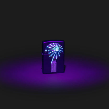 Lifestyle image of Zippo Black Light Lava Lamp Design Black Matte Windproof Lighter with the black light design glowing.